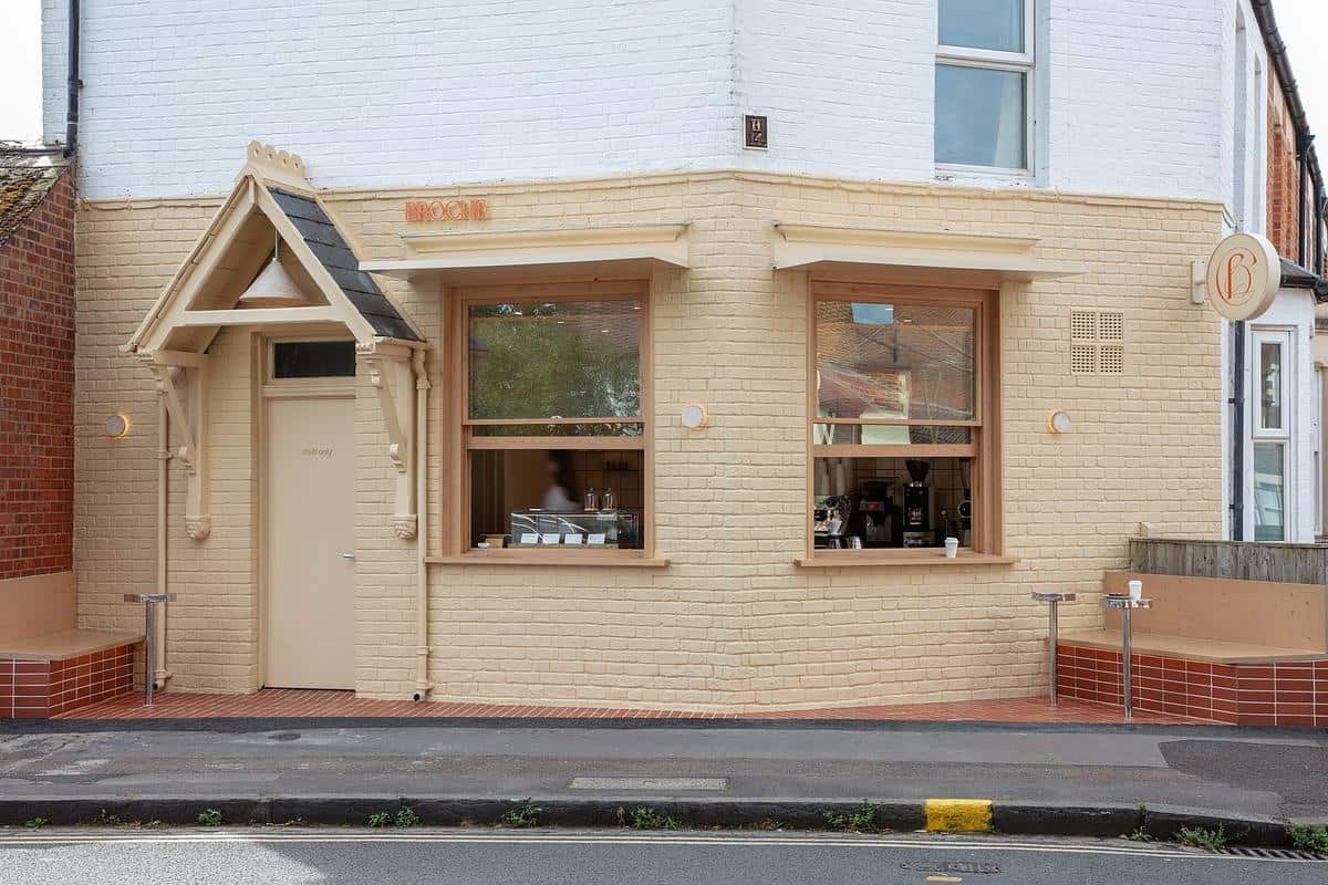 Coffee being poured in a cosy cafe