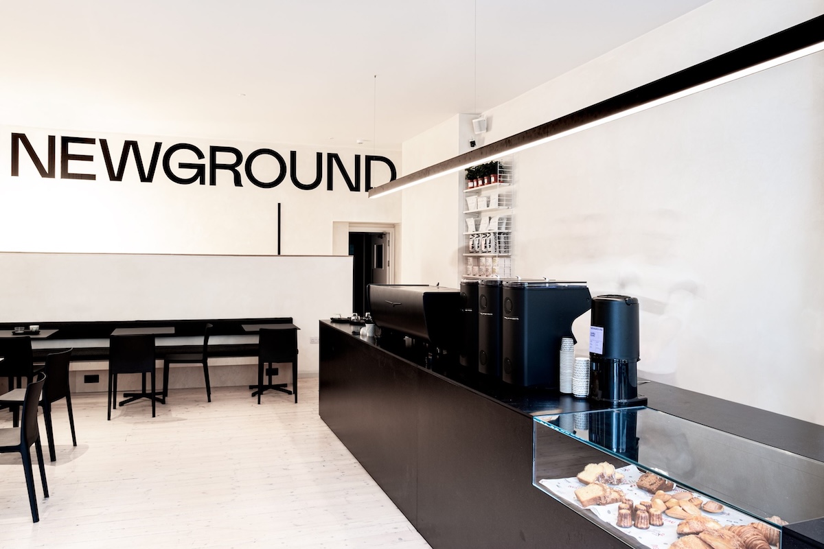 Coffee cup and laptop on a wooden table